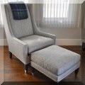 F07. Nailhead trim chair and ottoman by Kravet. 43"h x 30"w x 36"d 